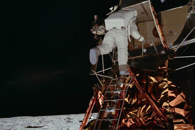 Buzz Aldrin climbing down the lunar module ladder.