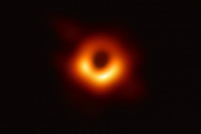 The black hole at the center of galaxy M87 and the ring of matter surrounding it.