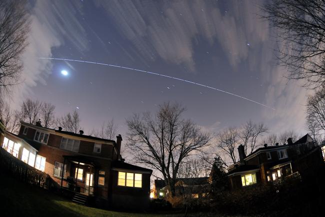 The International Space Station seen from Montreal. Automatic 5-second exposures created the dashed line effect.