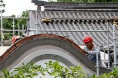 Renovations on the Chinese Garden – Summer 2017 - Tile setting on the roofs by Chinese workers.
