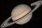 La planète Saturne vue par Voyager 2. On voit aussi la présence des lunes Téthys et son ombre sur la planète, Dioné et Rhéa.