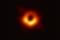The black hole at the center of galaxy M87 and the ring of matter surrounding it.