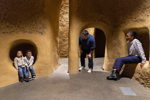 A family explores one of the alcoves of the Insectarium