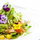 A salad prepared with edible flowers